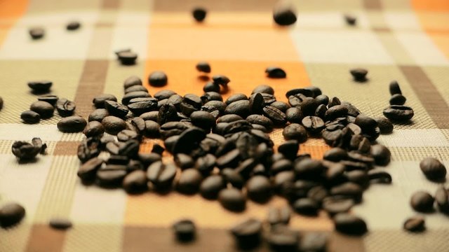 Roasted coffee beans poured in a heap