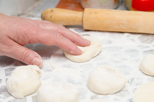 cooking cakes of the dough in the kitchen