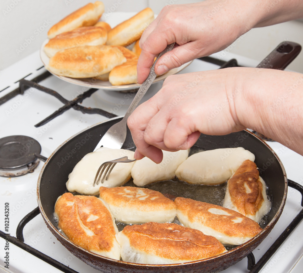 Wall mural Food patties in a frying pan