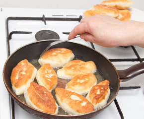 Food patties in a frying pan