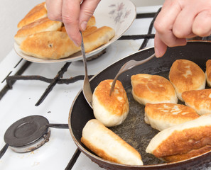 Food patties in a frying pan