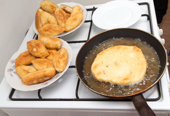 Food patties in a frying pan