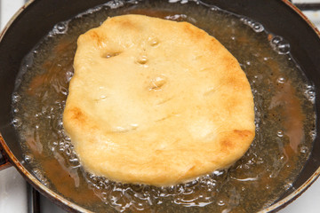 Food patties in a frying pan