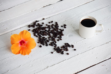 coffee cuo on white background with hibiscus flower