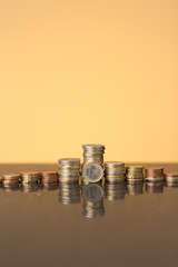 Stacks of coins with a golden glow