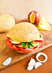 Healthy cheeseburger with vegetables