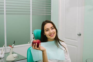 pretty young woman in a dental office.
