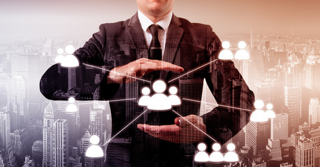 Hand carrying businessman icon network - HR,HRM,MLM, teamwork and leadership concept