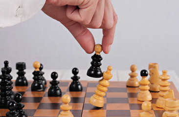 Man playing chess close up. Business strategy, success  and winner concept