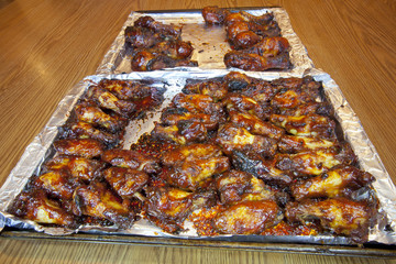 A batch of fresh cooked barbecue chicken wings.