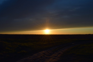 Sunset on a background field