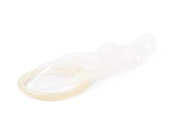 Unrolled latex condom isolated