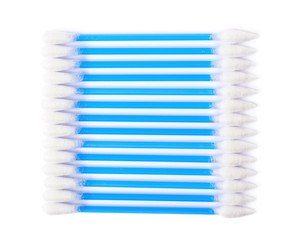 Row of multiple cotton swabs isolated