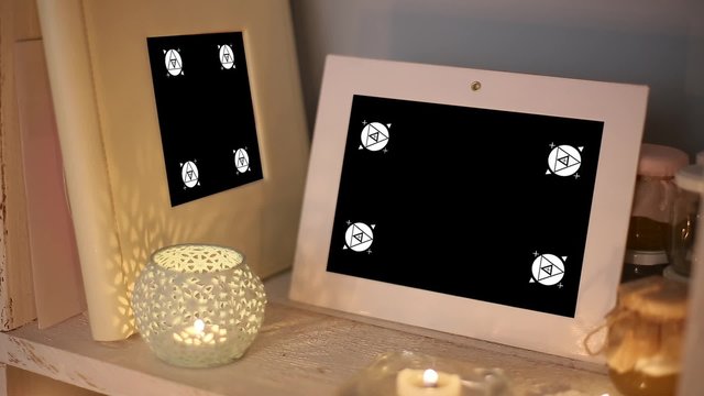 Mockup Video Displays Framework for Phototography are on the Shelf