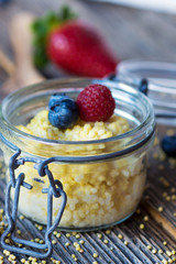 Millet porridge with milk and berries