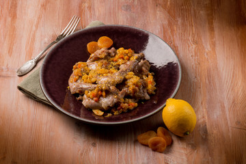 roasted rabbit with vegetables and dried apricot
