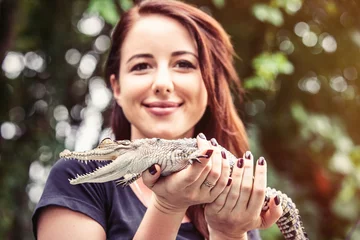Papier Peint photo autocollant Crocodile Young woman with crocodile