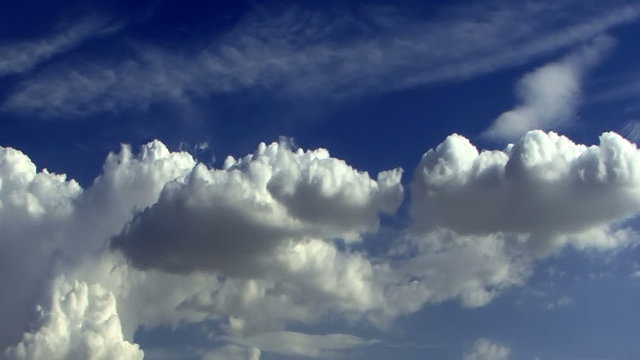 Fantastic Clouds 0104: Time lapse clouds travel across a blue sky.