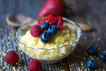 Millet porridge with milk and berries