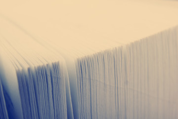Macro view of book pages. Toned image. Copy space for text