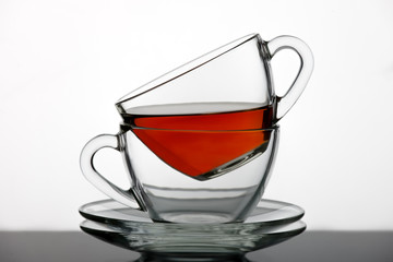 A set of tea cups poured black tea