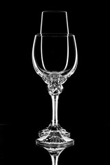Two glasses on a black background