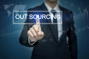Businessman hand touching OUT SOURCING button on virtual screen