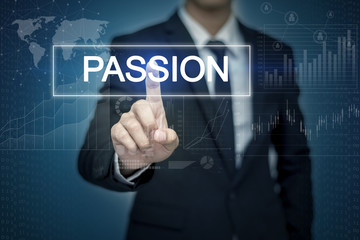 Businessman hand touching PASSION button on virtual screen