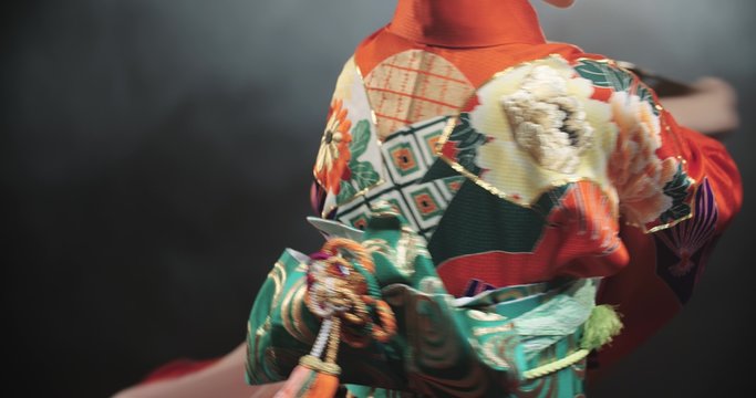 4k Close up of a beautiful Japanese Geisha posing for the camera, slow motion
