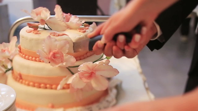 Pan view of beautiful wedding cake decorated with flowers