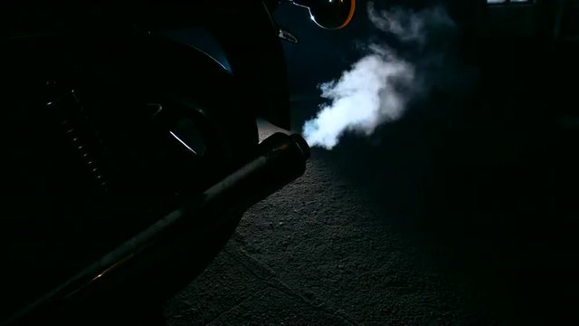 Close up of motorcycle exhaust fume.
4K 60 FPS slow motion shot