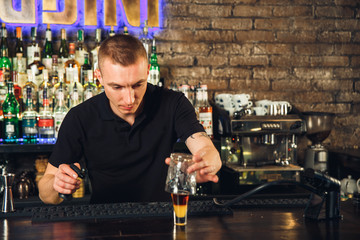 The bartender making cocktail