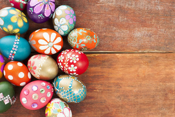 Colorful easter eggs on wooden board