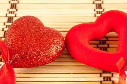 Valentine day concept - heart shaped lolly pop on wood background