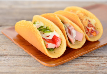  rolled pancakes stuffed ham and cheese.