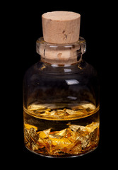 small bottle with gold