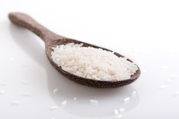 White rice on wooden spoon