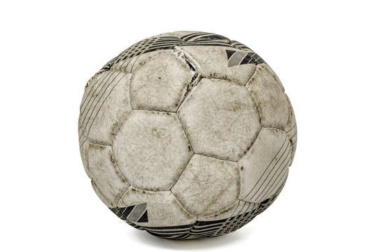Old torn soccer ball, isolated on white background