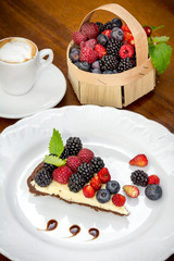 Cake dessert with coffee and forest fruits