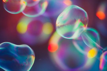 Soap bubbles floating in the air as the Summer sun sets