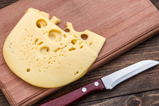 cheeses on a cutting board