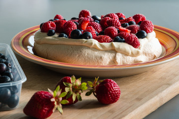 Pavlova dessert on kitchen top
