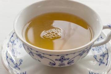  tea / white teacup with delicate blue pattern on a table 