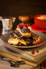 Chocolate eclairs and cup of coffie