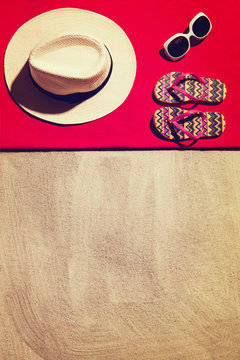 Top View Photograph Of Sandy Beach With Summer Accessories And Copy Space Around Objects. Horizontal Photo Taken From Above With Visible Sand Texture. Vintage, Retro Effect Processing.