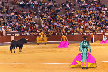 MADRID, SPAIN - SEPTEMBER 18: Matador and bull in bullfight on S