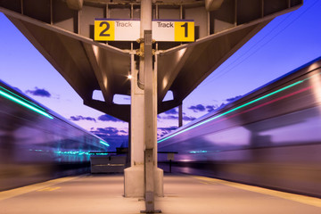 Trains Leaving the Station at Twilight