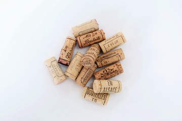 Several corks from French vineyards isolated on a white background