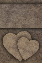 Obraz premium Two hearts on old wooden board