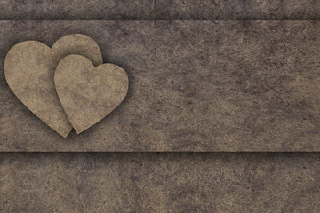Two hearts on old wooden board